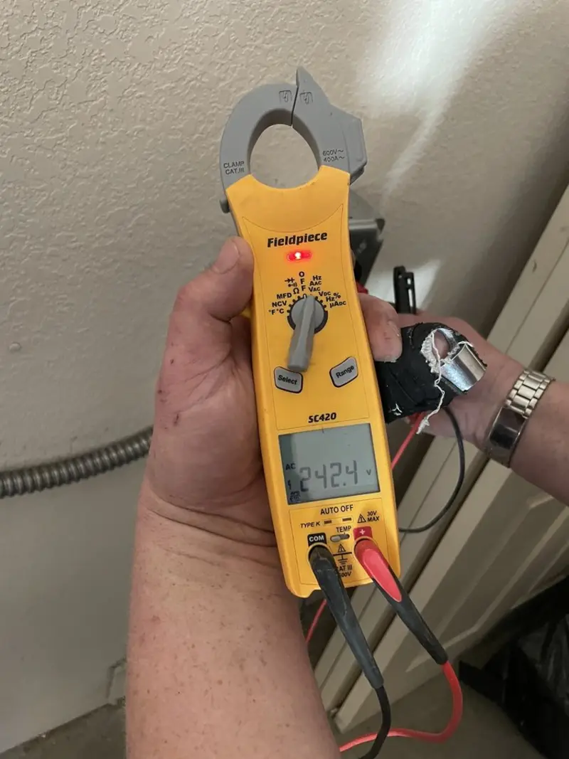 Voltage testing with clamp meter during Recessed Lighting Installation in Ashburnham